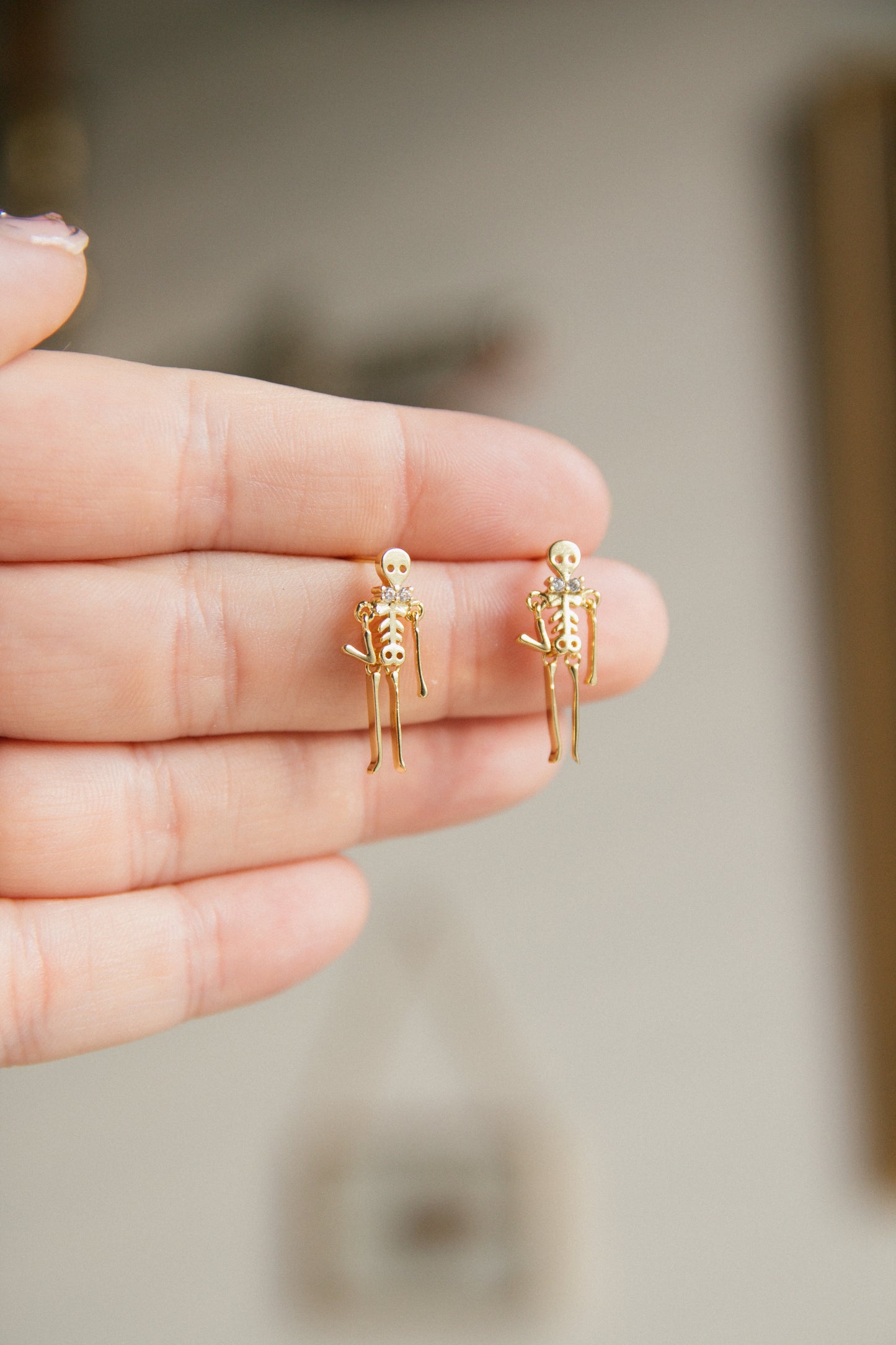 Drop Dead Skeleton Earrings - Gold
